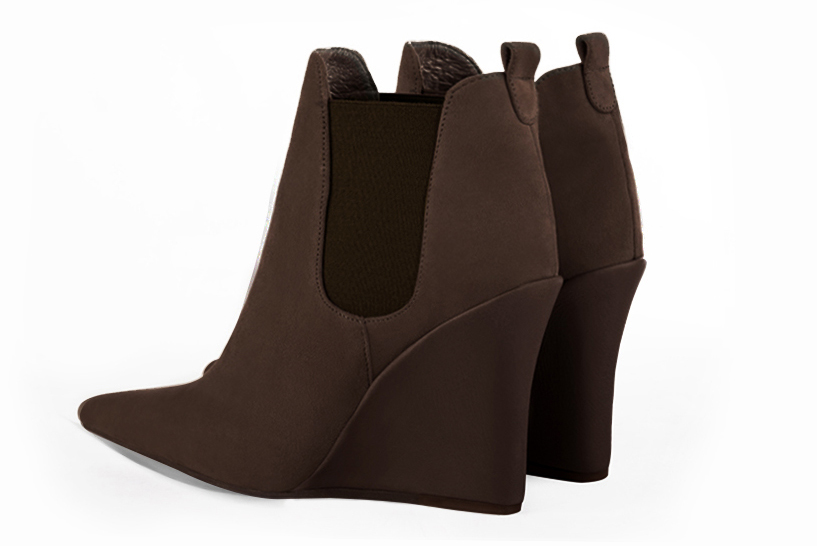 Dark brown women's ankle boots, with elastics. Pointed toe. Very high wedge heels. Rear view - Florence KOOIJMAN